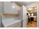 Bright pantry features tile countertops and ample cabinet space, conveniently connecting to the kitchen at 3660 Renovah St # 201, Las Vegas, NV 89129