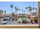 Community pool surrounded by palm trees in a well-maintained neighborhood on a sunny day at 3660 Renovah St # 201, Las Vegas, NV 89129