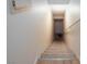 Carpeted staircase leading downstairs with a handrail, providing safe and easy access to the lower level at 3660 Renovah St # 201, Las Vegas, NV 89129