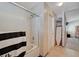 Bathroom with tiled floors, shower stall, and linen storage at 3747 Gulliver St, Las Vegas, NV 89115