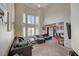 Bright living room featuring high ceilings, lots of natural light, and ample seating at 3747 Gulliver St, Las Vegas, NV 89115