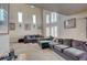 Spacious living room boasts vaulted ceilings, plantation shutters, and comfortable furnishings at 3747 Gulliver St, Las Vegas, NV 89115