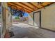 Covered patio with ceiling beams, concrete floor and multiple bicycles hung from the ceiling at 3747 Gulliver St, Las Vegas, NV 89115