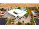 Stunning aerial view of a modern home with a pool and desert landscaping at 4135 N Durango Dr, Las Vegas, NV 89129