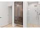 Bathroom featuring a cabinet for extra storage, and a sleek walk-in shower with rainfall showerhead at 4135 N Durango Dr, Las Vegas, NV 89129