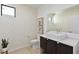 Elegant powder room featuring patterned wallpaper, floating vanity and vessel sink at 4135 N Durango Dr, Las Vegas, NV 89129