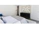 Bright bedroom featuring dark wood floors, a stylish dresser, and a neutral color palette at 4135 N Durango Dr, Las Vegas, NV 89129
