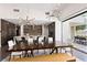Contemporary dining area with stylish lighting and open access to the outdoor space at 4135 N Durango Dr, Las Vegas, NV 89129