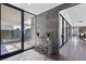 Modern entryway with glass walls, a view of the courtyard, and sleek interior design at 4135 N Durango Dr, Las Vegas, NV 89129
