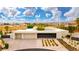 Modern home with clean lines, desert landscaping, and multi-car garage at 4135 N Durango Dr, Las Vegas, NV 89129