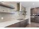 Well-appointed kitchen features sleek cabinetry, stainless steel appliances, and open shelving at 4135 N Durango Dr, Las Vegas, NV 89129