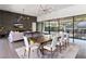 Bright and open living room featuring modern lighting, fireplace, and sliding doors at 4135 N Durango Dr, Las Vegas, NV 89129