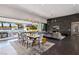 Open-concept living and dining area showcasing modern design and seamless outdoor access at 4135 N Durango Dr, Las Vegas, NV 89129