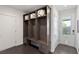 Mudroom with custom built-in storage and dark wood floors at 4135 N Durango Dr, Las Vegas, NV 89129