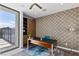 Stylish home office with modern desk, patterned wallpaper, built-in shelves, and natural light from the window at 4135 N Durango Dr, Las Vegas, NV 89129