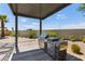 Outdoor grill area with a stainless steel grill, built-in counter, and desert landscaping at 4135 N Durango Dr, Las Vegas, NV 89129
