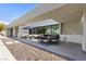 Covered outdoor patio featuring an outdoor kitchen and dining area, ideal for entertaining at 4135 N Durango Dr, Las Vegas, NV 89129