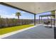 Spacious covered patio featuring artificial grass, modern landscaping and a hanging chair at 4135 N Durango Dr, Las Vegas, NV 89129
