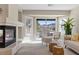 Balcony view featuring a fireplace, modern furniture, and access to a balcony with greenery and mountains at 4339 Grey Spencer Dr, Las Vegas, NV 89141