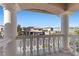 Balcony view overlooking neighboring houses, showcasing the residential neighborhood and clear blue sky at 4339 Grey Spencer Dr, Las Vegas, NV 89141