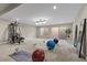 Spacious basement area with gym equipment, yoga mats, and mirrors, ideal for fitness activities at 4339 Grey Spencer Dr, Las Vegas, NV 89141