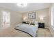 Serene bedroom featuring a comfortable bed, soft lighting, and access to the ensuite bathroom at 4339 Grey Spencer Dr, Las Vegas, NV 89141