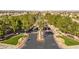Welcoming community entrance featuring lush landscaping, manicured lawns, and a secure gated entry for residents at 4339 Grey Spencer Dr, Las Vegas, NV 89141