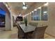 Inviting covered patio featuring outdoor seating, dining area, and stylish lighting, ideal for enjoying outdoor meals and gatherings at 4339 Grey Spencer Dr, Las Vegas, NV 89141