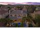 A home with a private backyard pool, covered patio, and lush landscaping, creating an ideal outdoor oasis at 4339 Grey Spencer Dr, Las Vegas, NV 89141