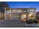 Grand two-story home with a three-car garage, manicured landscaping, and a spacious front yard at 4339 Grey Spencer Dr, Las Vegas, NV 89141