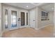Bright foyer with hardwood floors, decorative glass doors, and storage cabinets at 4339 Grey Spencer Dr, Las Vegas, NV 89141