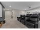 Basement home theater with plush reclining chairs, a large projector screen, and integrated surround sound system at 4339 Grey Spencer Dr, Las Vegas, NV 89141
