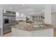 Modern kitchen with granite countertops, stainless steel appliances, and ample cabinet space at 4339 Grey Spencer Dr, Las Vegas, NV 89141