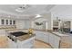 Open kitchen with granite countertops, white cabinetry, and a central island with cooktop at 4339 Grey Spencer Dr, Las Vegas, NV 89141