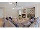 Bright living room area featuring cozy fireplace, elegant decor and modern lighting at 4339 Grey Spencer Dr, Las Vegas, NV 89141