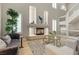 Inviting living room area with cozy fireplace, stylish furniture, and elegant decor at 4339 Grey Spencer Dr, Las Vegas, NV 89141