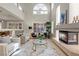 Bright and airy living room with high ceilings, a fireplace, and large windows offering plenty of natural light at 4339 Grey Spencer Dr, Las Vegas, NV 89141