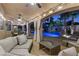 Relaxing covered patio area with comfortable seating overlooking the pool and landscaped backyard at 4339 Grey Spencer Dr, Las Vegas, NV 89141