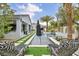 Tranquil backyard with a sleek pool, manicured landscaping, and stylish lounge seating for ultimate relaxation at 4345 N Dapple Gray Rd, Las Vegas, NV 89129