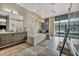 Bright bathroom featuring a large tub, dual sinks, wooden cabinets and walk-in shower at 4345 N Dapple Gray Rd, Las Vegas, NV 89129