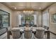 Elegant dining area with large table and modern chandelier that offers plenty of light at 4345 N Dapple Gray Rd, Las Vegas, NV 89129