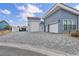 A paved driveway leads to a spacious three-car garage, providing ample parking and a seamless exterior at 4345 N Dapple Gray Rd, Las Vegas, NV 89129