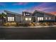 Stunning single-story home featuring modern design, xeriscaping, and a vibrant blue and gray color palette at 4345 N Dapple Gray Rd, Las Vegas, NV 89129