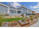 Landscaped yard featuring stone accents, artificial turf, and a walkway leading to the home's front entrance at 4345 N Dapple Gray Rd, Las Vegas, NV 89129