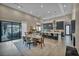 Open-concept kitchen and dining area with ample seating and a view to the backyard at 4345 N Dapple Gray Rd, Las Vegas, NV 89129