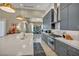 Island offers tons of counter space, seating, and extra storage in this modern kitchen at 4345 N Dapple Gray Rd, Las Vegas, NV 89129