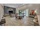 Open-concept living and dining area showcasing modern lighting and seamless design at 4345 N Dapple Gray Rd, Las Vegas, NV 89129