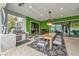Covered patio with an outdoor kitchen, a spacious dining area, and elegant decor for a perfect entertaining experience at 4345 N Dapple Gray Rd, Las Vegas, NV 89129