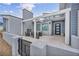 Modern outdoor patio featuring a fireplace, comfortable seating, and a stylish pergola for relaxing and entertaining at 4345 N Dapple Gray Rd, Las Vegas, NV 89129
