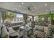Expansive covered patio with comfortable seating, a large dining table, and a full outdoor kitchen, ideal for gatherings at 4345 N Dapple Gray Rd, Las Vegas, NV 89129